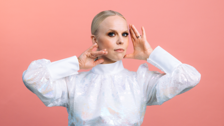 Aili Ikonen wearing a white dress.