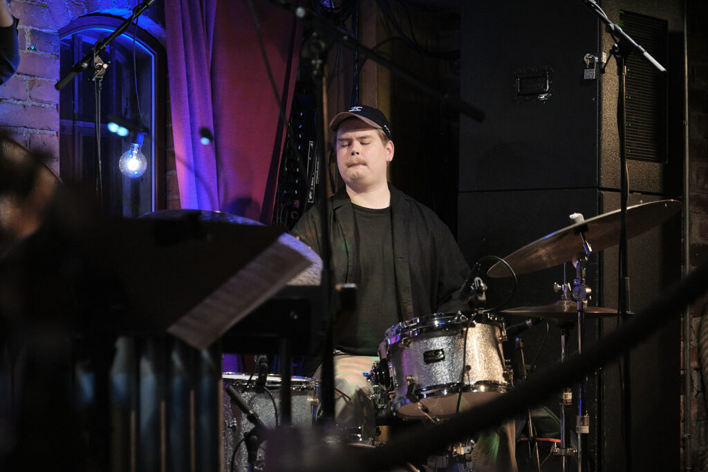 Mooses Kuloniemi is playing the drums.
