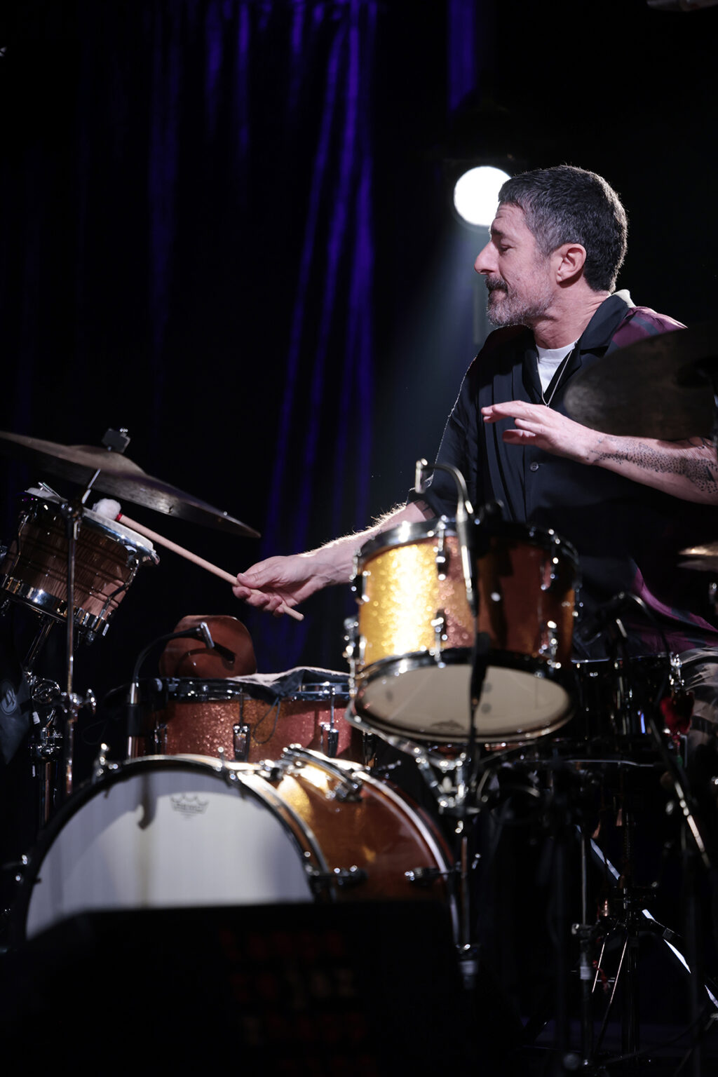 How Noisy Are The Rooms? is performing on the stage.