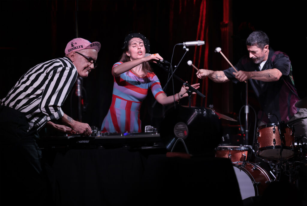 How Noisy Are The Rooms? is performing on the stage.