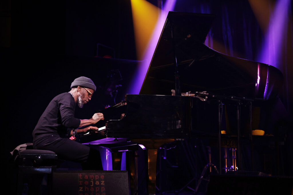 James Brandon Lewis Quartet is performing on the stage.