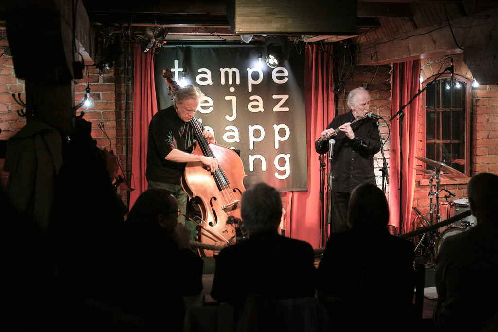 Juhani Aaltonen Trio is performing on the stage.