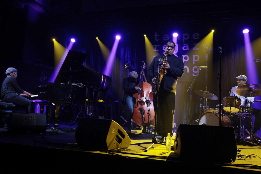 James Brandon Lewis Quartet is performing on the stage.