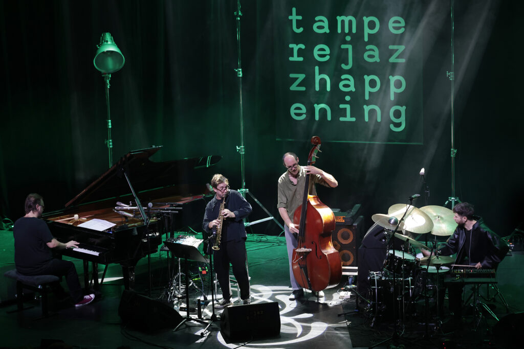 Émile Parisien Quartet is performing on the stage.