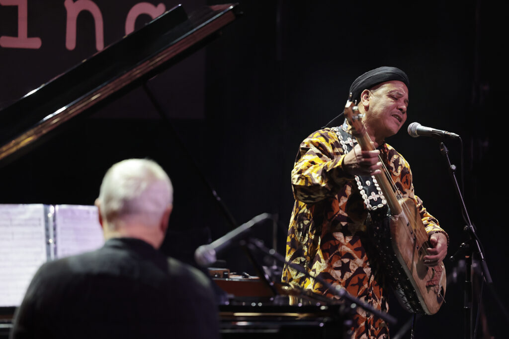 Trio Raulin, Bekkas, Biayenda is performing on the stage.