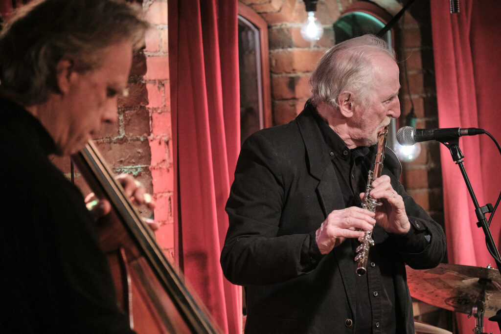 Juhani Aaltonen Trio is performing on the stage.