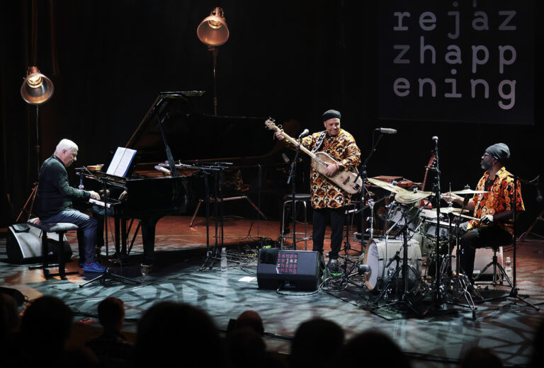 Trio Raulin, Bekkas, Biayenda is performing on the stage.