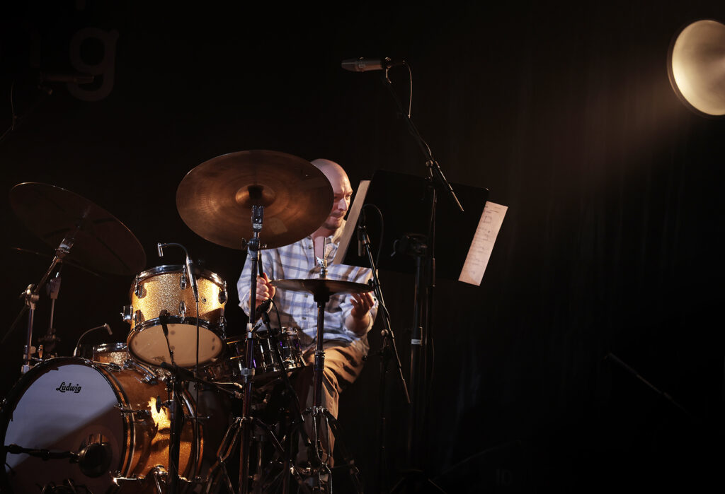 Jay Davis is playing the drums.