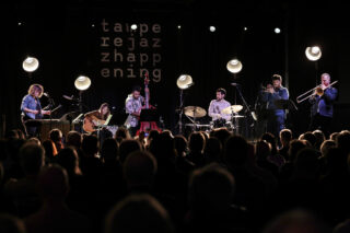 Mary Halvorson Amaryllis Sextet is performing on the stage.