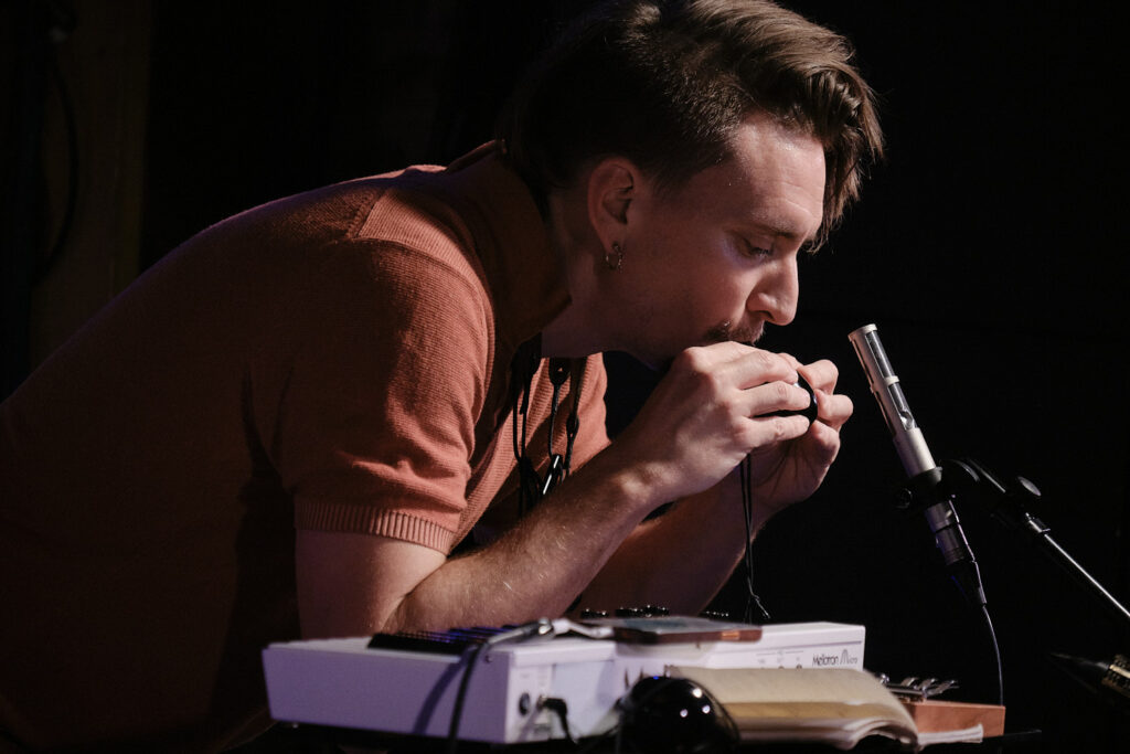 Pauli Lyytinen is performing on the stage.