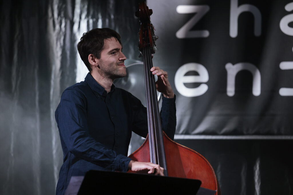 Tom McCredie is playing the bass.