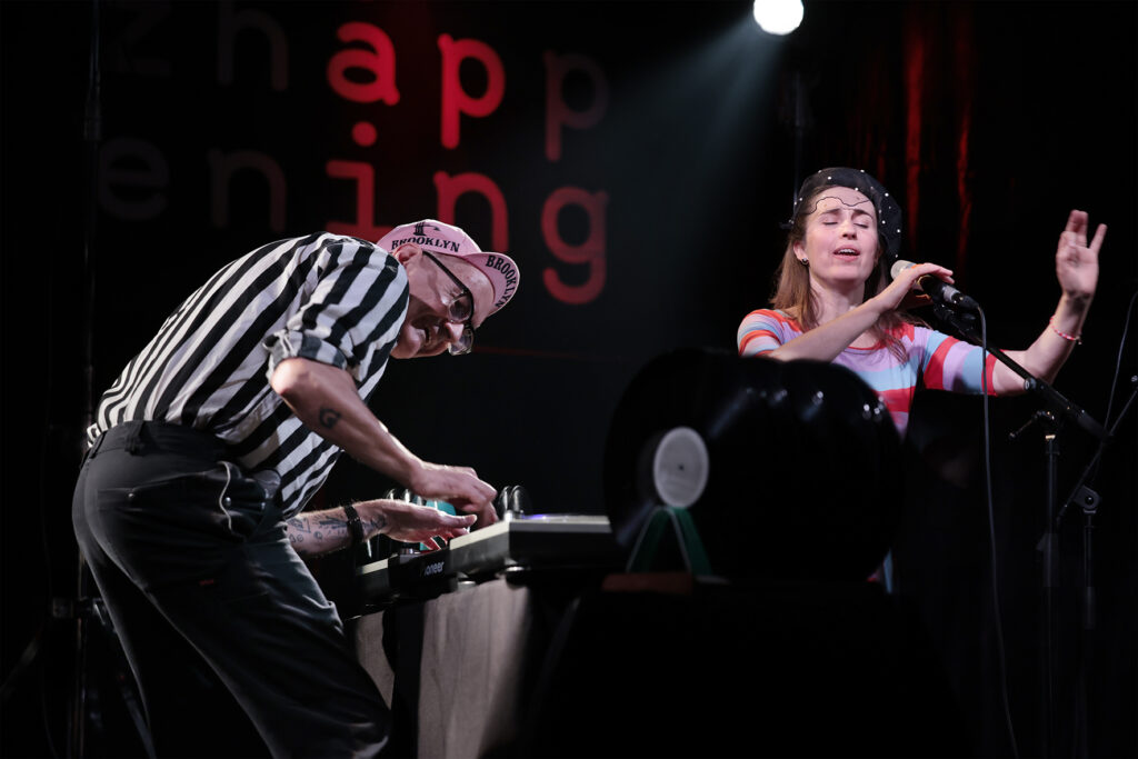 How Noisy Are The Rooms? is performing on the stage.