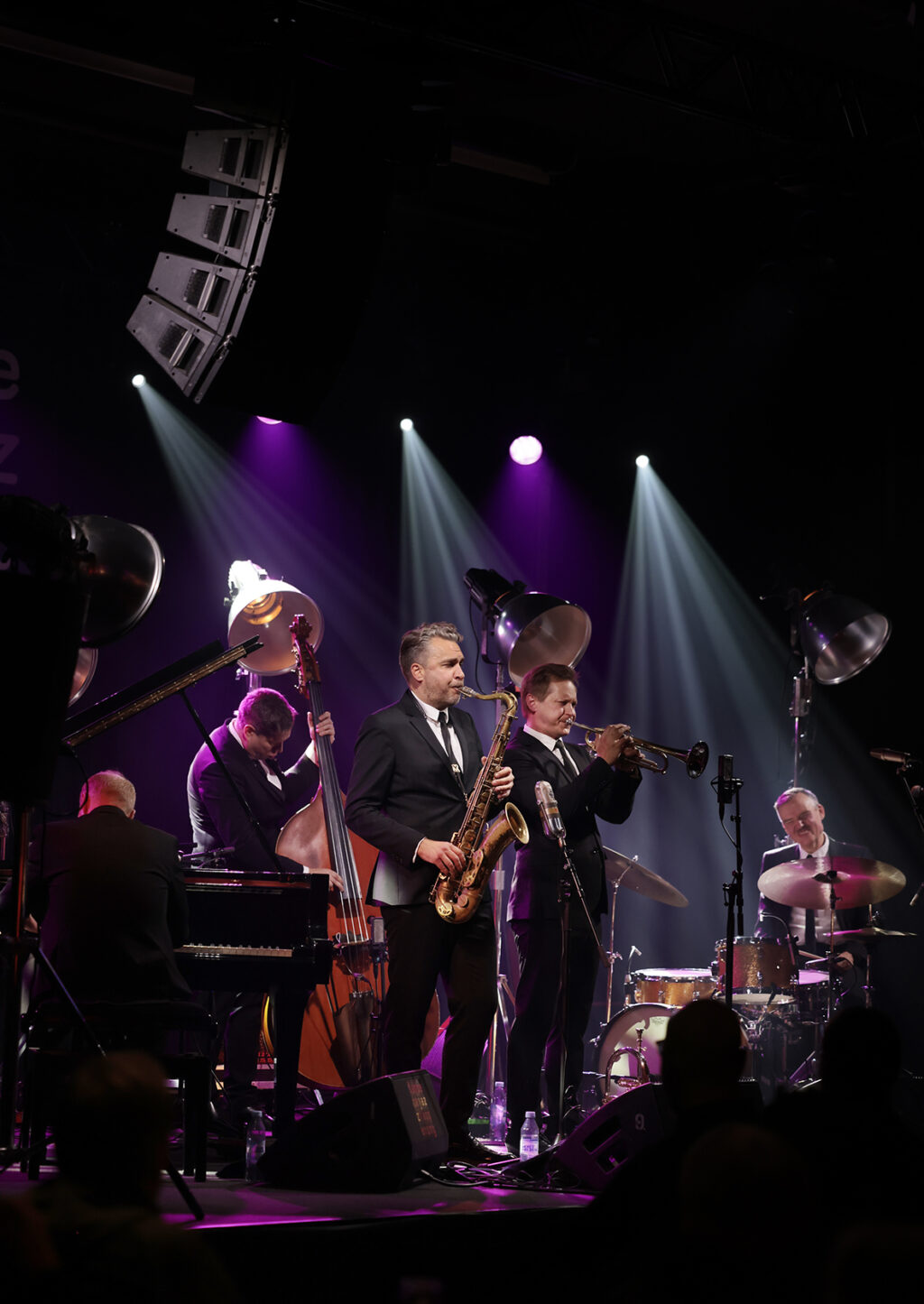 The Five Corners Quintet is performing on the stage.