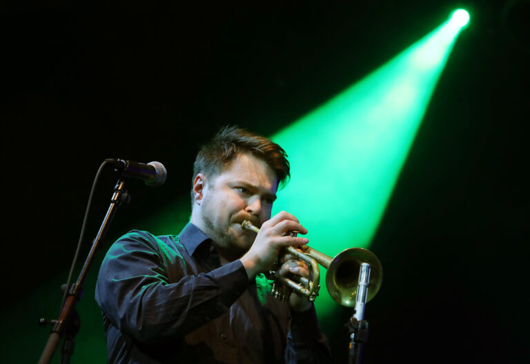 Verneri Pohjola is playing the trumpet.