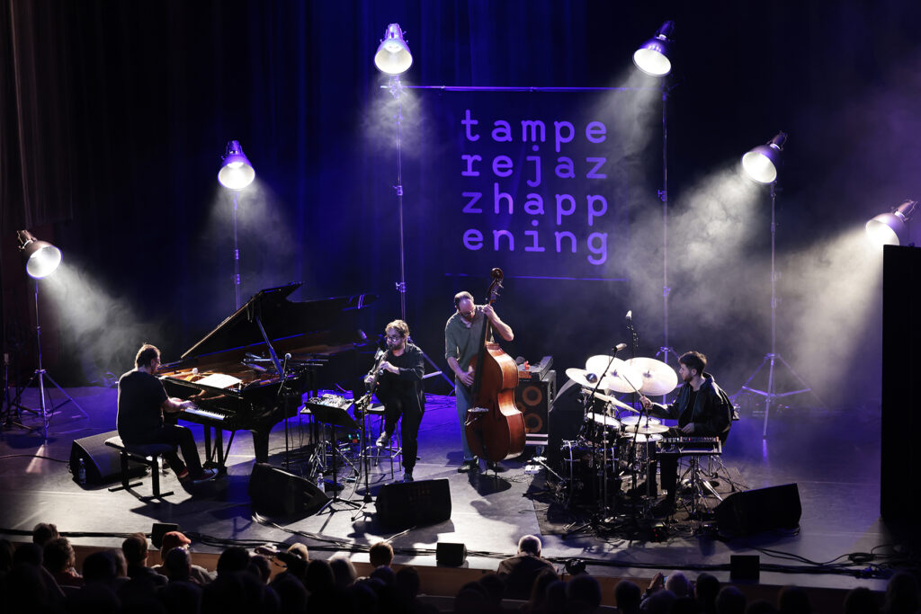 Émile Parisien Quartet is performing on the stage.