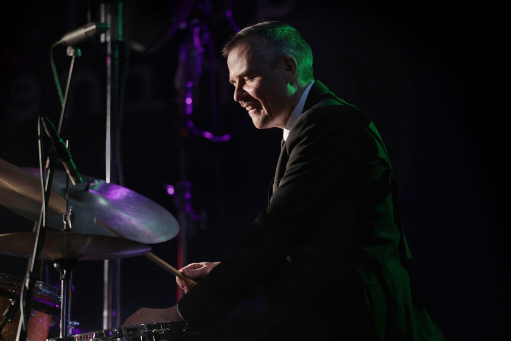 The Five Corners Quintet is performing on the stage.